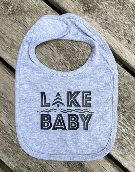 Heather grey cotton bib with black HTV logo that reads LAKE BABY.